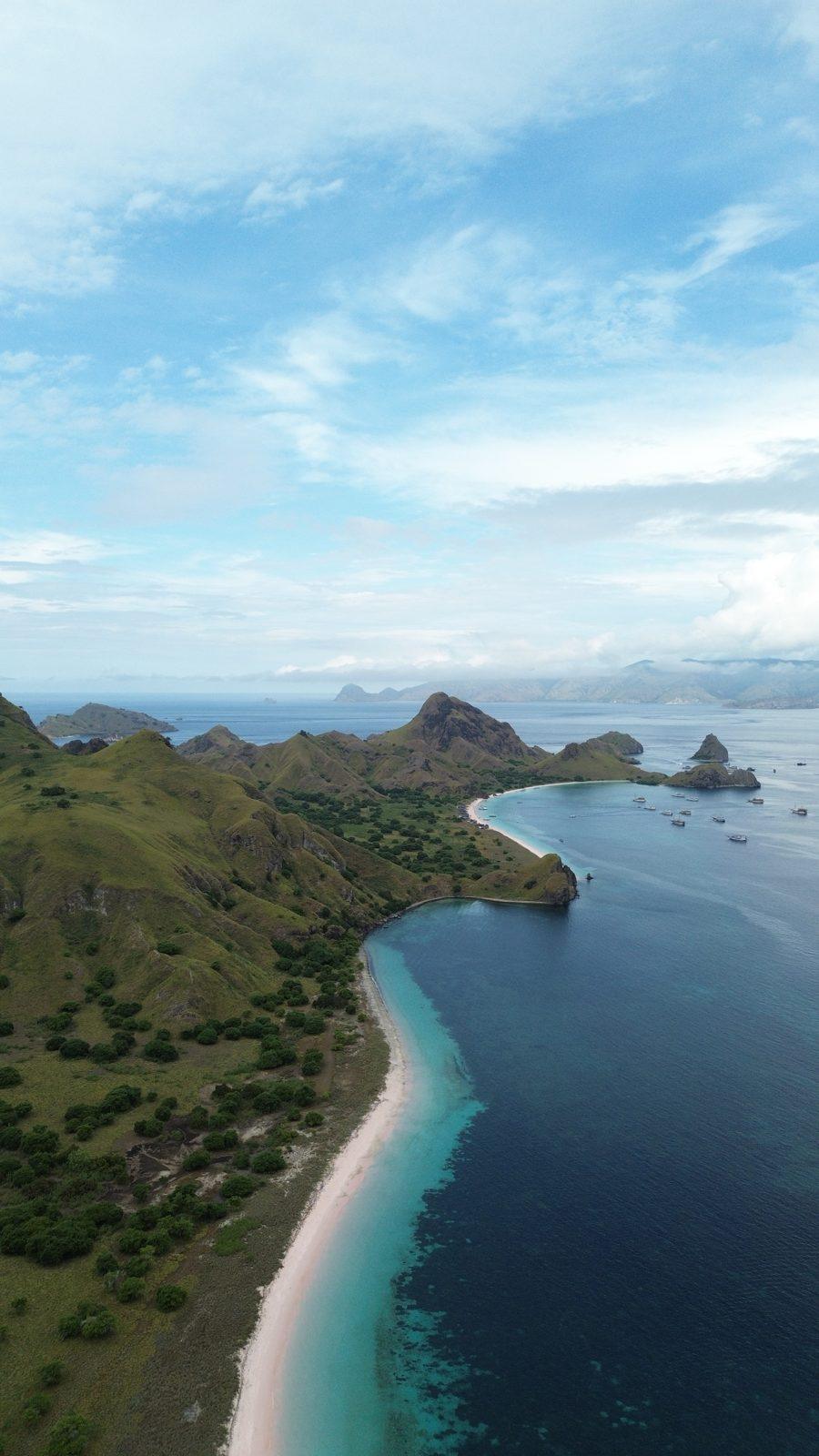Padar – Aerial green headland, curved white beach (Real photo from a KEXI trip)